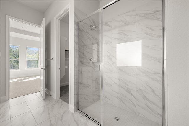 full bathroom featuring marble finish floor, baseboards, and a marble finish shower