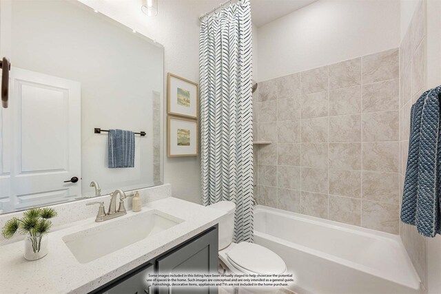 full bath with toilet, vanity, and shower / bath combo with shower curtain