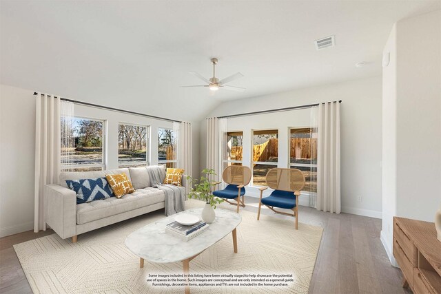 living area with ceiling fan, light wood-type flooring, visible vents, lofted ceiling, and baseboards