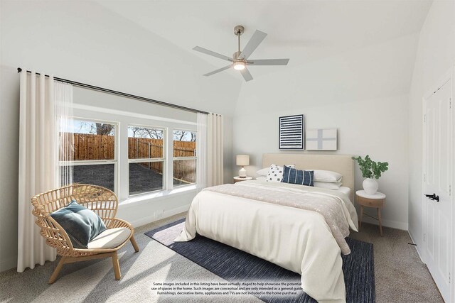 carpeted bedroom featuring ceiling fan, baseboards, and vaulted ceiling