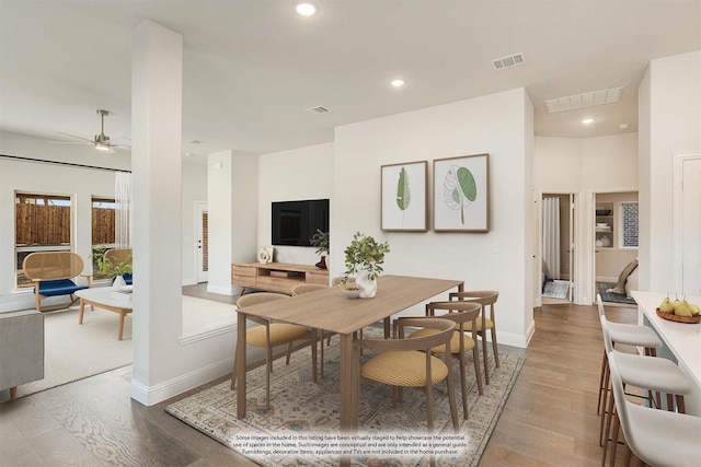 dining space featuring baseboards, recessed lighting, visible vents, ceiling fan, and wood finished floors
