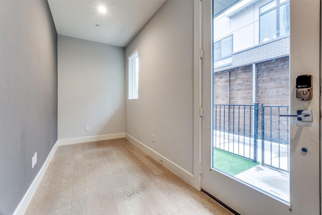 5707 Lindell Ave Unit 204, Dallas, TX 75206 - unfurnished room with a wealth of natural light, light wood-type flooring, and baseboards