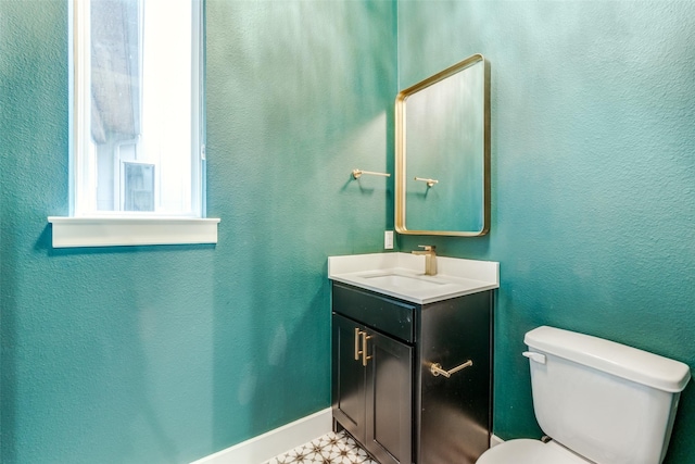 5707 Lindell Ave Unit 204, Dallas, TX 75206 - bathroom featuring toilet, vanity, and baseboards