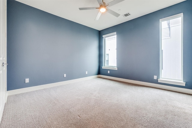 5707 Lindell Ave Unit 204, Dallas, TX 75206 - carpeted empty room featuring visible vents, ceiling fan, baseboards, and a healthy amount of sunlight