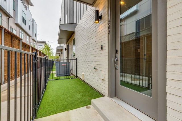 5707 Lindell Ave Unit 204, Dallas, TX 75206 - exterior space with brick siding, fence, and cooling unit