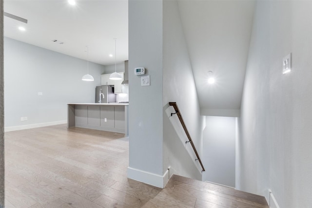 5707 Lindell Ave Unit 204, Dallas, TX 75206 - stairs featuring baseboards, recessed lighting, and wood finished floors