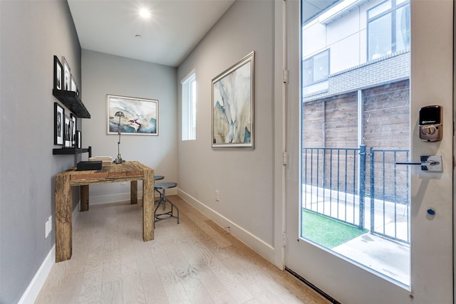 5707 Lindell Ave Unit 204, Dallas, TX 75206 - kitchen featuring freestanding refrigerator, wall chimney range hood, white cabinetry, light countertops, and a ceiling fan