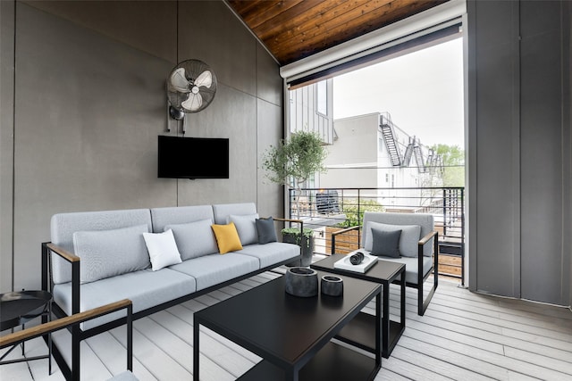 5707 Lindell Ave Unit 204, Dallas, TX 75206 - kitchen featuring freestanding refrigerator, wall chimney exhaust hood, light wood-style flooring, white cabinets, and a ceiling fan