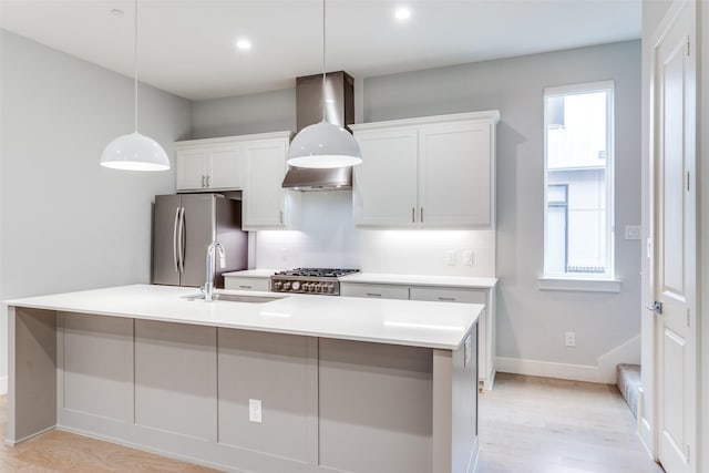 5707 Lindell Ave Unit 204, Dallas, TX 75206 - kitchen featuring a sink, light countertops, freestanding refrigerator, light wood finished floors, and range