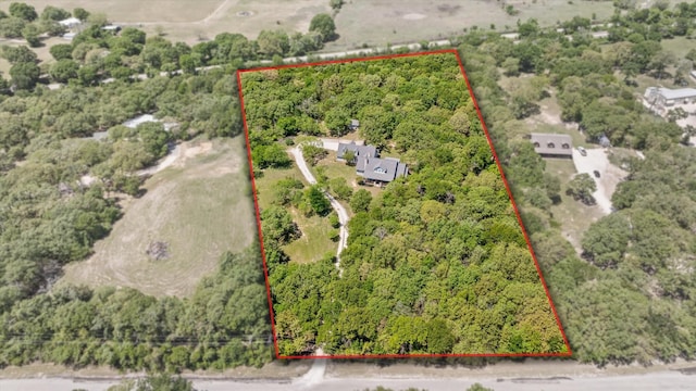 4726 Rawhide Ct, Granbury, TX 76049 - aerial view of property and surrounding area with a forest and property parcel outlined