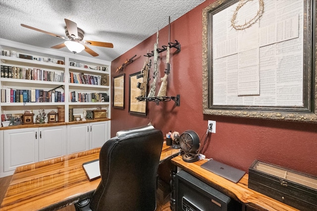 5197 Zion Hill Rd, Weatherford, TX 76088 - home office featuring a ceiling fan, a textured ceiling, a textured wall, and built in shelves