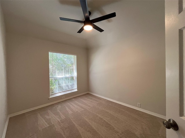 unfurnished room featuring carpet flooring, baseboards, and a ceiling fan