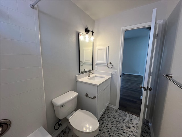 full bathroom with toilet, vanity, and walk in shower