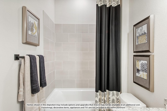 bathroom with shower / tub combo and toilet