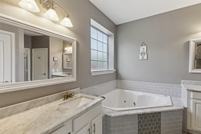 2605 Owl Creek Dr, Plano, TX 75025 - bathroom featuring a jetted tub and vanity