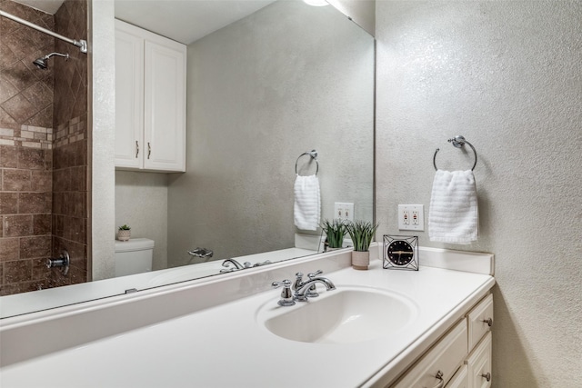 full bath featuring toilet and vanity
