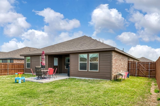 9449 Firedog Dr, Fort Worth, TX 76131 - back of house featuring a fenced backyard, a patio, a shingled roof, and brick siding