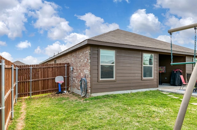 9449 Firedog Dr, Fort Worth, TX 76131 - back of house with brick siding, roof with shingles, and a patio