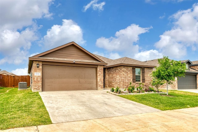 9449 Firedog Dr, Fort Worth, TX 76131 - ranch-style house with central AC unit, brick siding, concrete driveway, a garage, and a shingled roof