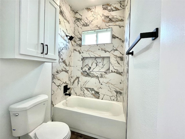 bathroom featuring toilet and  shower combination