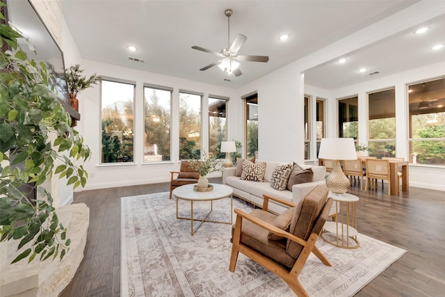 living room with visible vents, wood finished floors, baseboards, ceiling fan, and recessed lighting