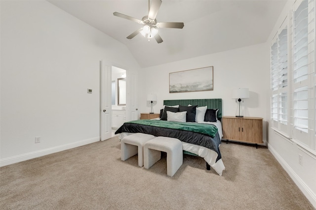 bedroom with baseboards, multiple windows, lofted ceiling, and light carpet