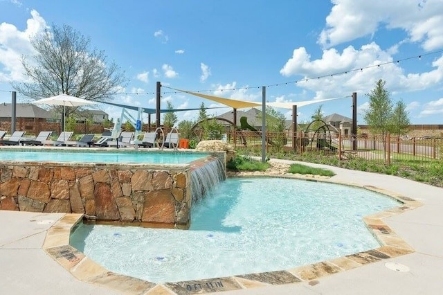 view of swimming pool featuring a fenced in pool and fence