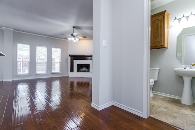 1314 Kingsley Ct, Allen, TX 75013 - unfurnished living room with a brick fireplace, hardwood / wood-style floors, ornamental molding, and ceiling fan