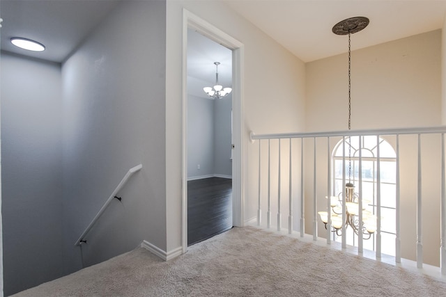 1314 Kingsley Ct, Allen, TX 75013 - corridor with an upstairs landing, baseboards, an inviting chandelier, and carpet floors