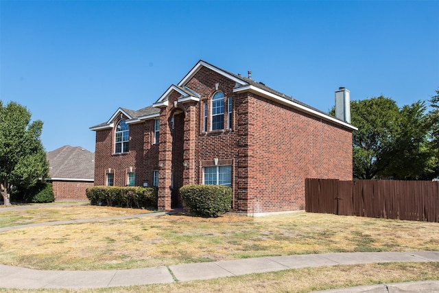 1314 Kingsley Ct, Allen, TX 75013 - view of property exterior with brick siding, fence, a lawn, and a chimney