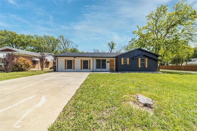 3452 Antilles Dr, Mesquite, TX 75150 - view of front of home with driveway, board and batten siding, and brick siding