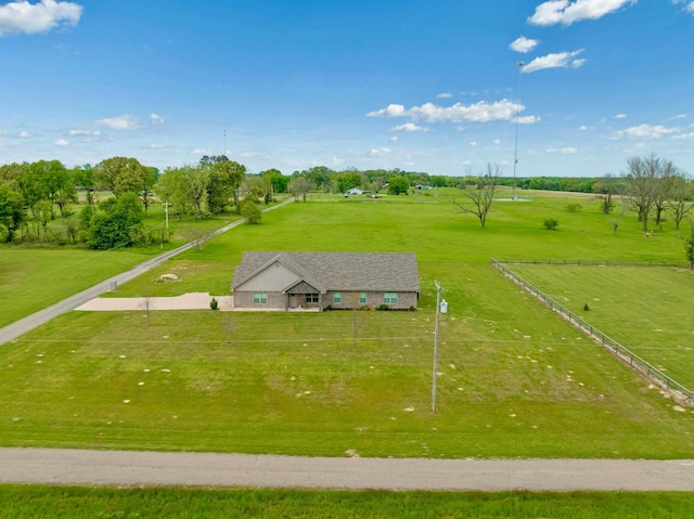 birds eye view of property with a rural view