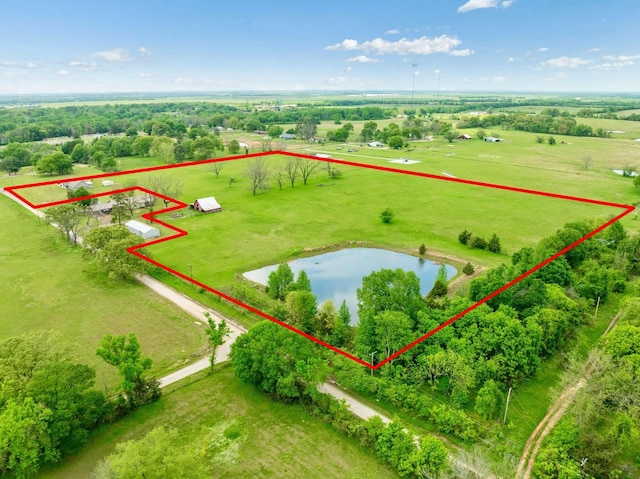 birds eye view of property with a rural view and a water view