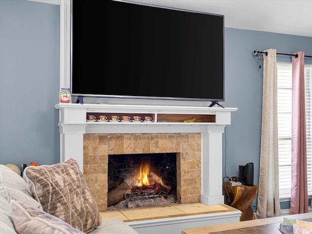 details with a tiled fireplace