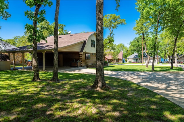 view of side of home with a yard