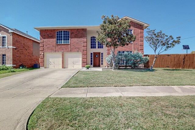 8202 Silverton Dr, Arlington, TX 76001 - traditional-style house with an attached garage, driveway, fence, and brick siding