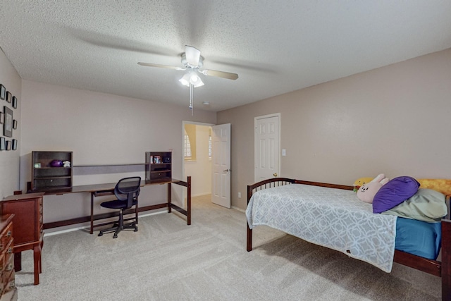 8202 Silverton Dr, Arlington, TX 76001 - carpeted bedroom with a textured ceiling, baseboards, and a ceiling fan