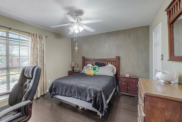 8202 Silverton Dr, Arlington, TX 76001 - bedroom with dark wood-style floors, a textured ceiling, and ceiling fan
