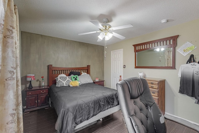 8202 Silverton Dr, Arlington, TX 76001 - bedroom featuring a textured ceiling, baseboards, a ceiling fan, and dark wood finished floors