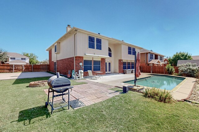8202 Silverton Dr, Arlington, TX 76001 - rear view of house with a fenced in pool, a patio, a chimney, brick siding, and a fenced backyard