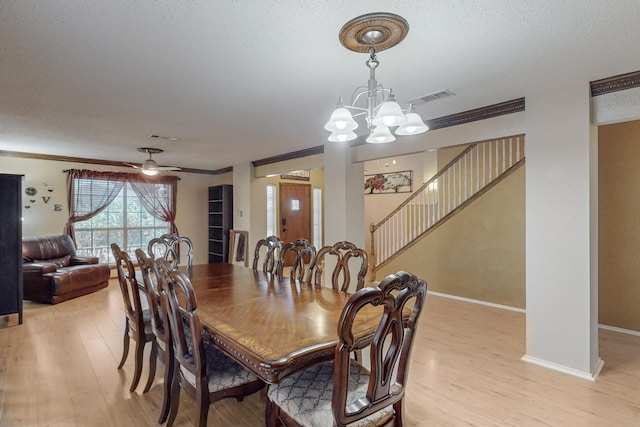 8202 Silverton Dr, Arlington, TX 76001 - dining room with baseboards, stairs, visible vents, light wood finished floors, and ceiling fan with notable chandelier