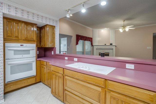 kitchen featuring ceiling fan, ornamental molding, white appliances, and light tile patterned floors
