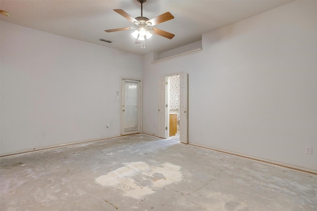 spare room with a ceiling fan and visible vents
