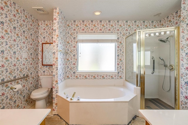 full bath featuring a shower stall, a textured ceiling, a bath, vanity, and toilet