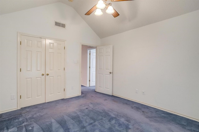 unfurnished bedroom featuring visible vents, carpet, a closet, ceiling fan, and high vaulted ceiling