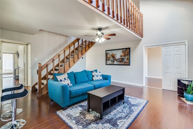 1028 Signal Ridge Pl, Rockwall, TX 75032 - living area with stairway, baseboards, wood finished floors, and ceiling fan