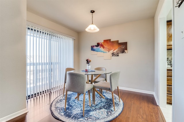 1028 Signal Ridge Pl, Rockwall, TX 75032 - dining area featuring baseboards and wood finished floors