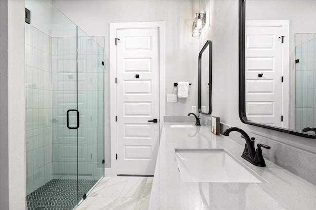 bathroom featuring a sink and a shower stall