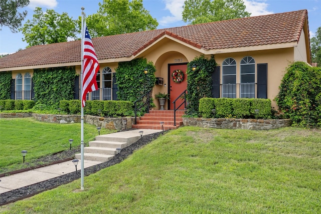 1803 Michael Ct, Arlington, TX 76010 - view of front of property with stucco siding, a tile roof, and a front lawn