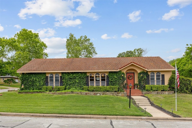 1803 Michael Ct, Arlington, TX 76010 - view of front facade with a tile roof, stucco siding, and a front yard